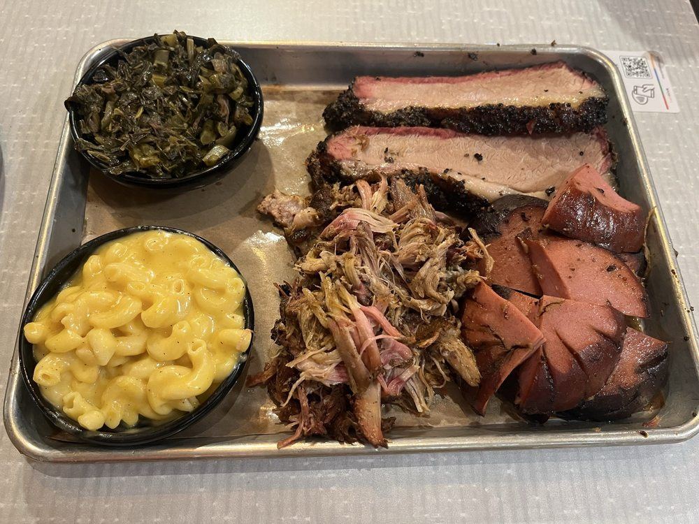 Three-meat dinner with brisket, pulled pork and smoked bologna, mac and cheese and collard greens
